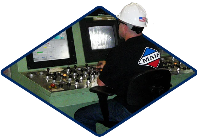 Madicorp Worker At Control Panel Our Mission