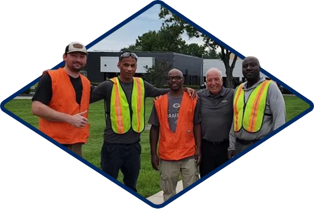 Men In Saftey Vests Madicorp Defines Community