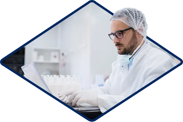 Scientist At Computer Overcoming Production Delays