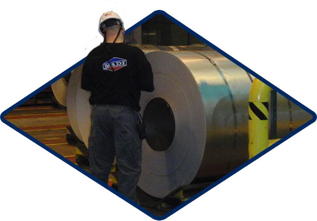 Mc Aerospace Defense Man Saftey Hat Inspecting Rolls Of Material