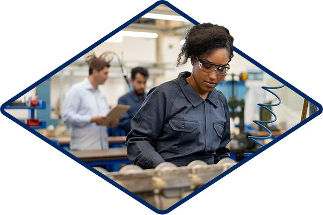 Mc Aerospace Defense Woman With Saftey Glasses Working Machine